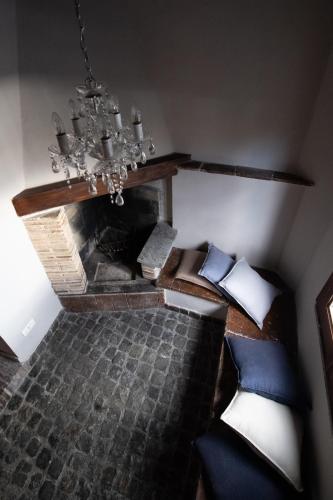 an overhead view of a bedroom with a fireplace at Hotel Borgo Vistalago in Trevignano Romano