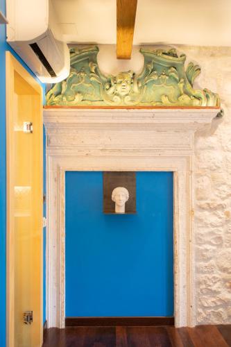 a blue wall in a room with a ceiling at Domus Maritima in Trogir