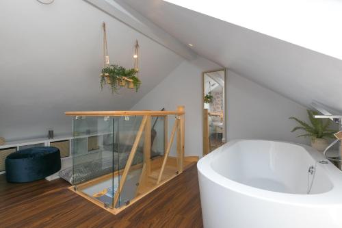 a bathroom with a bath tub in a room at Will's Rock in St Ives