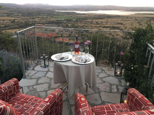 a table with a white table cloth and flowers on it at View Hotel Boutique in San Miguel de Allende