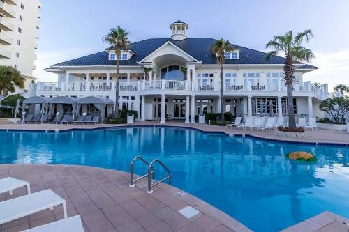 a large building with a large swimming pool at Bristol 205 - Beachfront Condo with Breathtaking Views in Gulf Shores