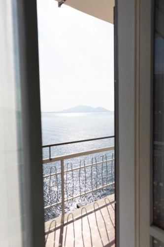 a view of the ocean from a window at La Foresta Monteisola in Monte Isola