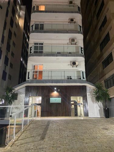 a white building with a staircase in front of it at Hotel Imperador in Santos