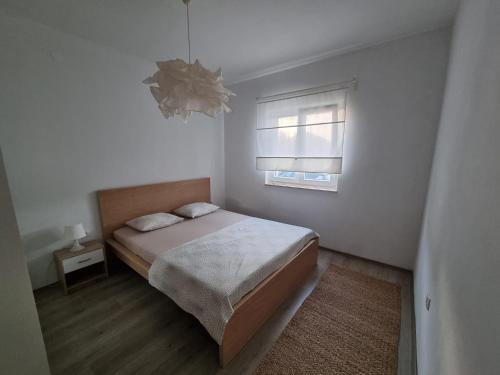 מיטה או מיטות בחדר ב-Vila Regina
