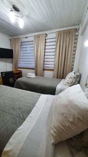 Cama o camas de una habitación en Hostal Las Heras