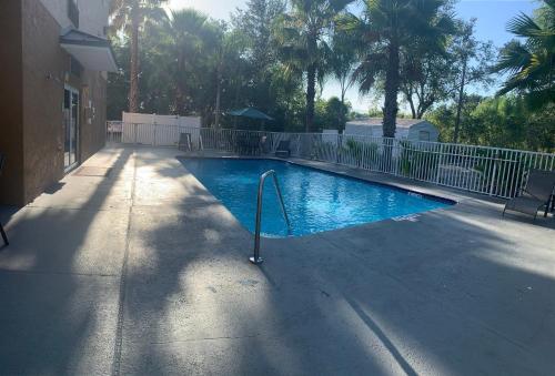 a swimming pool in the middle of a house at Econo Lodge in Wesley Chapel