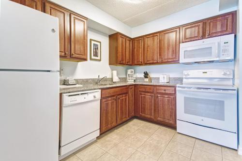 a kitchen with a stove, refrigerator, microwave and sink at Club Wyndham Skyline Tower in Atlantic City