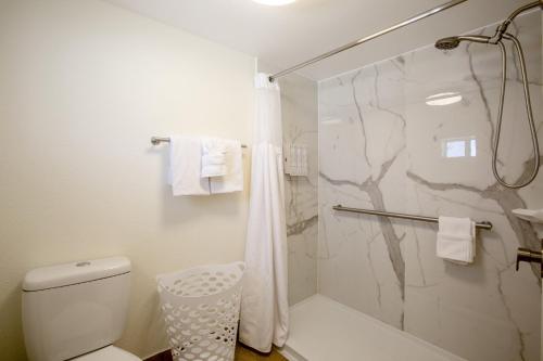 a bathroom with a shower and a toilet at Dreamcatcher Inn of Sedona in Sedona