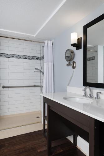 a bathroom with a sink and a shower at Club Wyndham Riverside Suites in San Antonio
