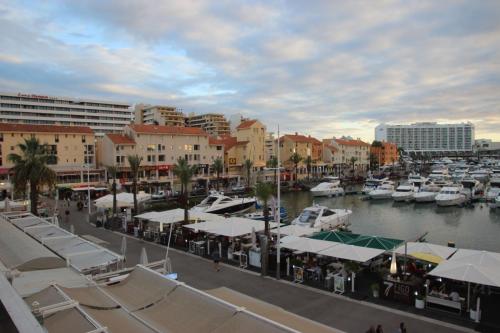 a marina with boats in the water and buildings at Marina 2 in Vilamoura