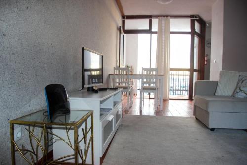 a living room with a table and a couch at Marina 2 in Vilamoura