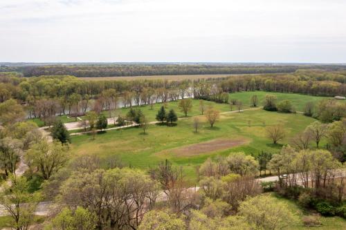 an aerial view of a field with trees at SAND HILL COTTAGE 3 Bedroom Home near PURDUE! River & Park View in West Lafayette