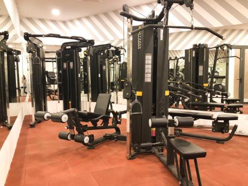 a gym with several rows of tread machines at DQua Hotel in Nha Trang