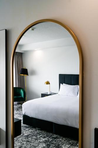Ένα ή περισσότερα κρεβάτια σε δωμάτιο στο The Benson Hotel