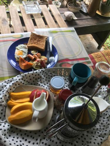 a table with a plate of food on a table at Homebar in Ko Chang