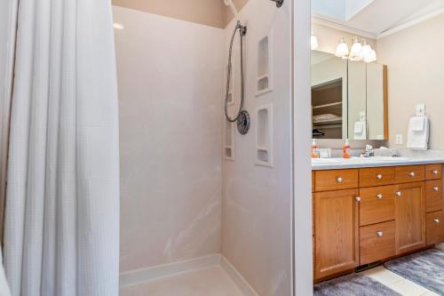 a bathroom with a shower and a sink at The Wild Rose in Sagle