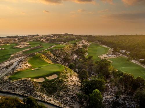 an aerial view of the golf course at the resort at Holiday Inn Resort Ho Tram Beach by IHG in Ho Tram