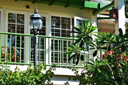 a street light sitting in front of a window at Hotel Deli River and Restaurant Omlandia in Medan