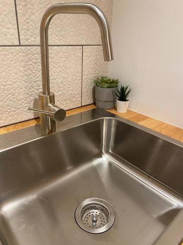a stainless steel kitchen sink with a faucet at Fontana Sunset in Carolina