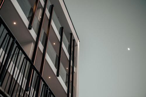 a building with black and white windows on it at Seehotel Panorama Relax in Resia
