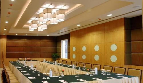 a large room with a long table with chairs at Fortune Inn Sree Kanya, Visakhapatnam - Member ITC Hotels' Group in Visakhapatnam