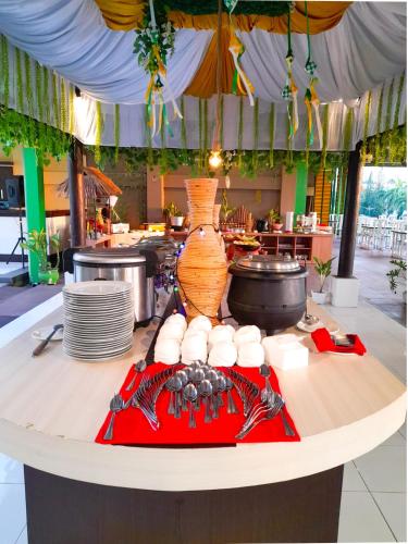 a table with plates of food on top at Grand Madani Hotel in Mataram