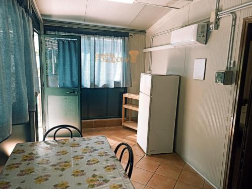 A kitchen or kitchenette at Camping Poseidonia
