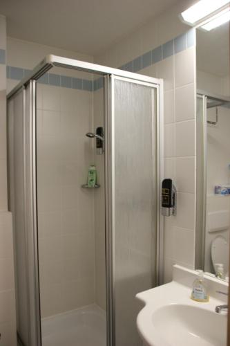 a bathroom with a shower and a sink at Apartement 270 Mitterdorf in Mitterfirmiansreut