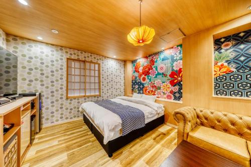 A bed or beds in a room at Hotel Lotus Gorgeous Japan Kyoto -Adult Only
