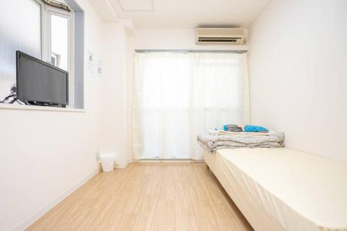 Giường trong phòng chung tại it senriyama 203
