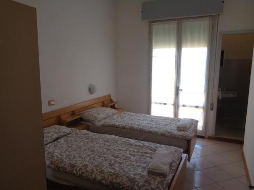 Postel nebo postele na pokoji v ubytování Hotel Gazza