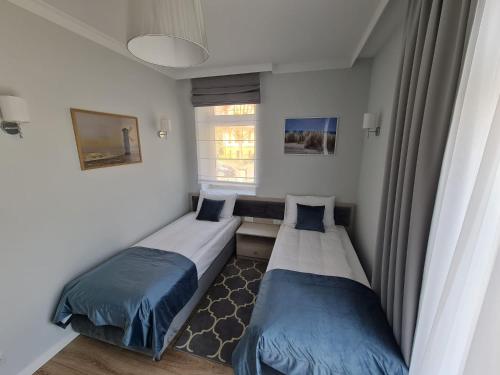 Кровать или кровати в номере Villa Babette - PARKING, Wi-Fi, Reinigung - alles im Preis inbegriffen!