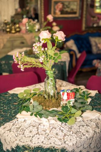 a vase filled with flowers on a table at Big 5 Guest House Witbank in Witbank