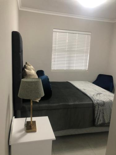 Postel nebo postele na pokoji v ubytování MLMK Property Studio17