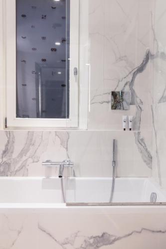 a bathroom with a sink and a mirror at Hotel Palazzina Grassi in Venice