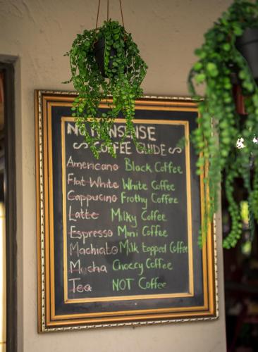 a chalkboard with a sign on a wall at Big 5 Guest House Witbank in Witbank