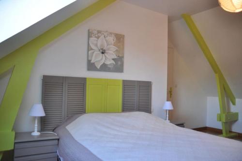 En eller flere senge i et værelse på Le Pressoir