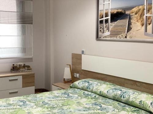 Säng eller sängar i ett rum på Bajo en primera línea de playa