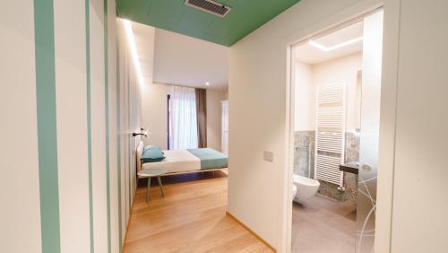 Säng eller sängar i ett rum på Vietti Apartments