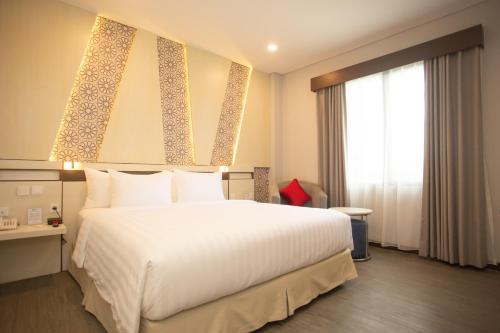 Кровать или кровати в номере Best Western Batang Garing