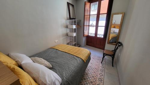 Giường trong phòng chung tại Exclusivo Apartamento en Linares