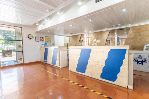 a room with a wall with blue paint on it at Hotel da Aldeia - Adults Only in Albufeira