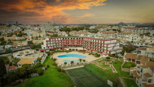 an aerial view of a large building with a tennis court at Hotel da Aldeia - Adults Only in Albufeira