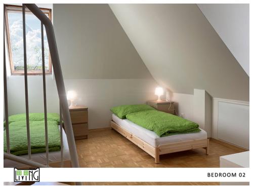 a bedroom with a green bed and two night stands at ACO Living - A chilli Overnight in Klagenfurt