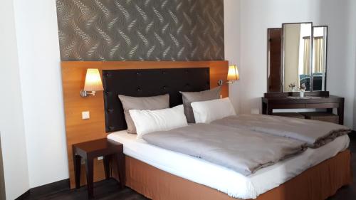 Letto o letti in una camera di Hotel Habichtstein