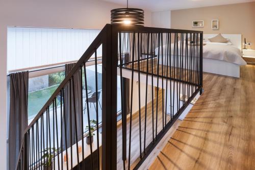 a bedroom with a bed and a balcony at Vila Rina in Bled