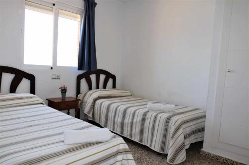 Posteľ alebo postele v izbe v ubytovaní 14F MAR II 1 dormitorio