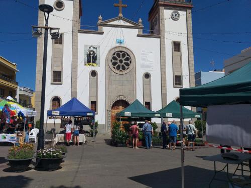 a large white church with a clock tower at Loft en La Aldea de San Nicolas in La Aldea de San Nicolas