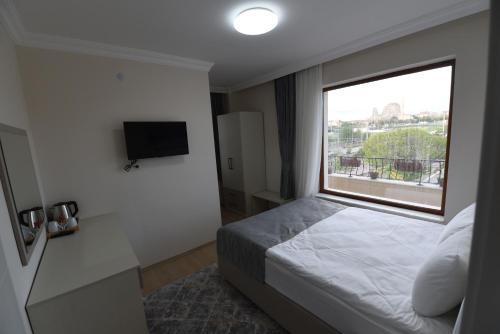 Letto o letti in una camera di Trigo Hotel