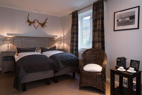Un pat sau paturi într-o cameră la Nermo Hotel & Apartments